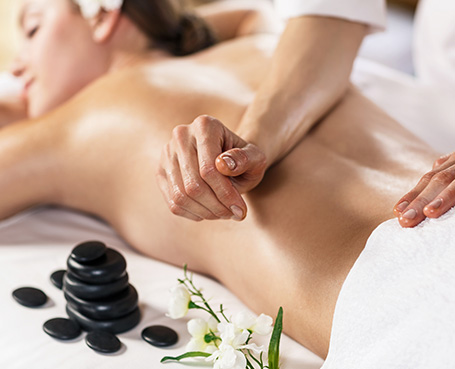 Hands And Warm Stone Infusion Image